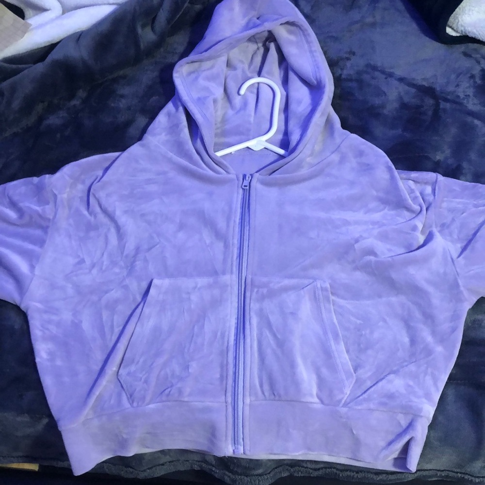 a purple crop top sweater